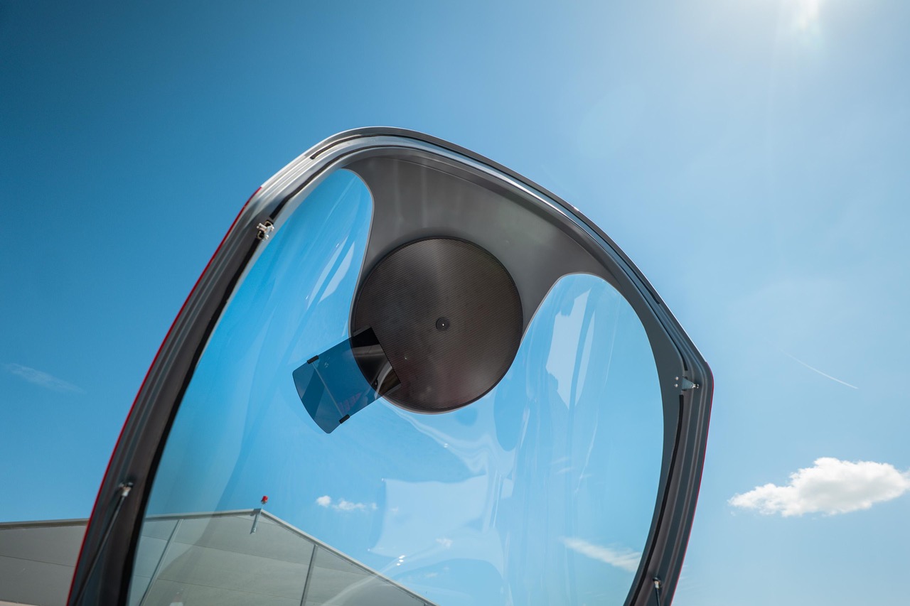 Carbon-fiber Q Sun Visor form photographed against a clear blue sky