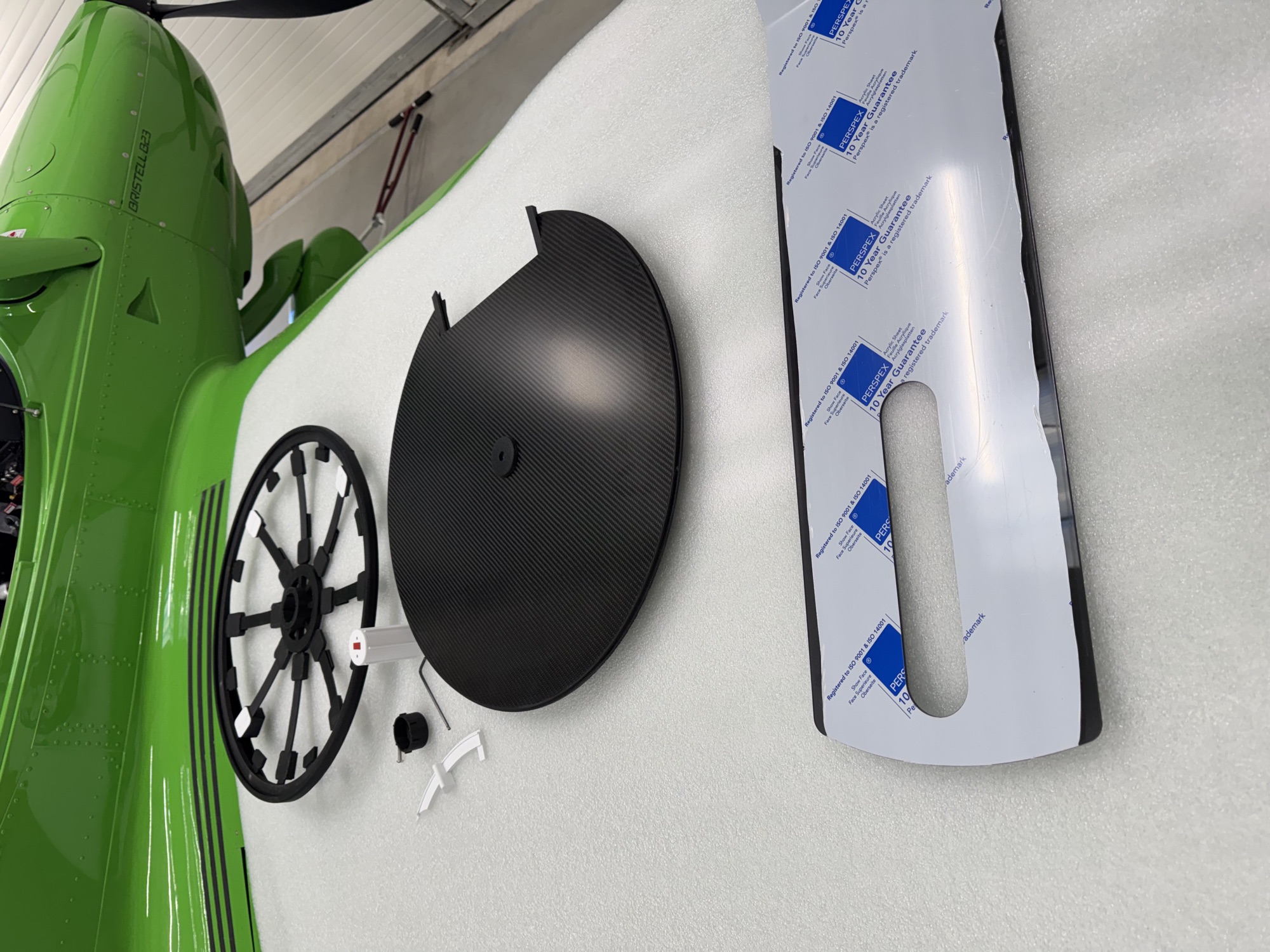 Installation takes 20–30 minutes. The photo shows the components of the Q-Sun Visor.